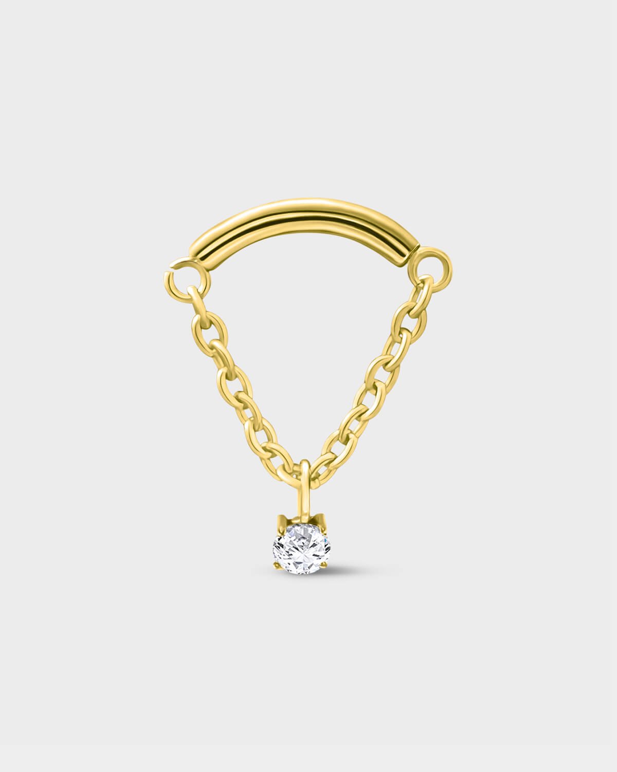 24k gold PVD titanium earring used for hidden helix or hidden rook featuring a smooth curved bar with a chain connected at each end and a single clear solitaire pendent on a light grey background.