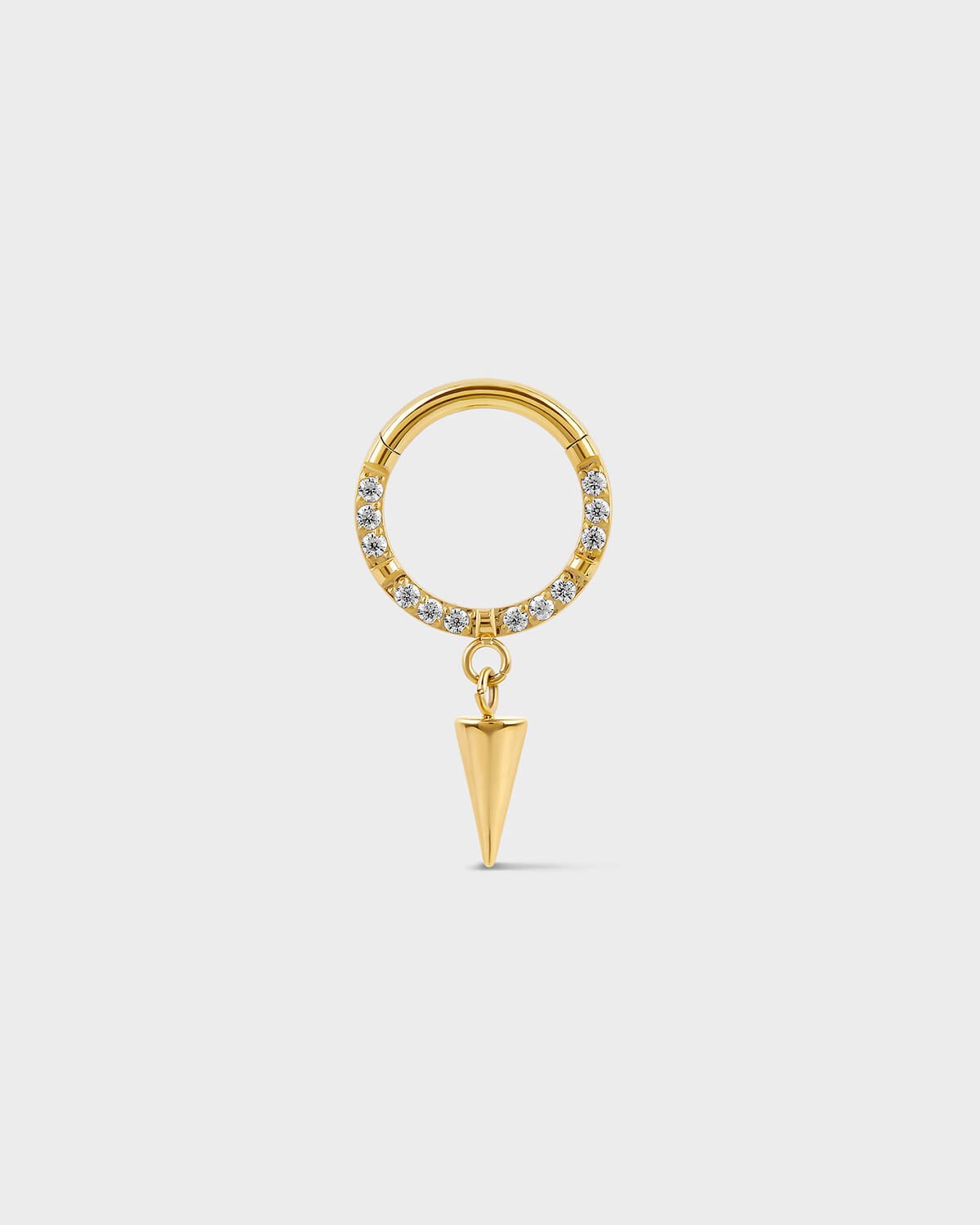 Semi pave gold titanium daith septum ring with dangle cone charm on a ligh gray background