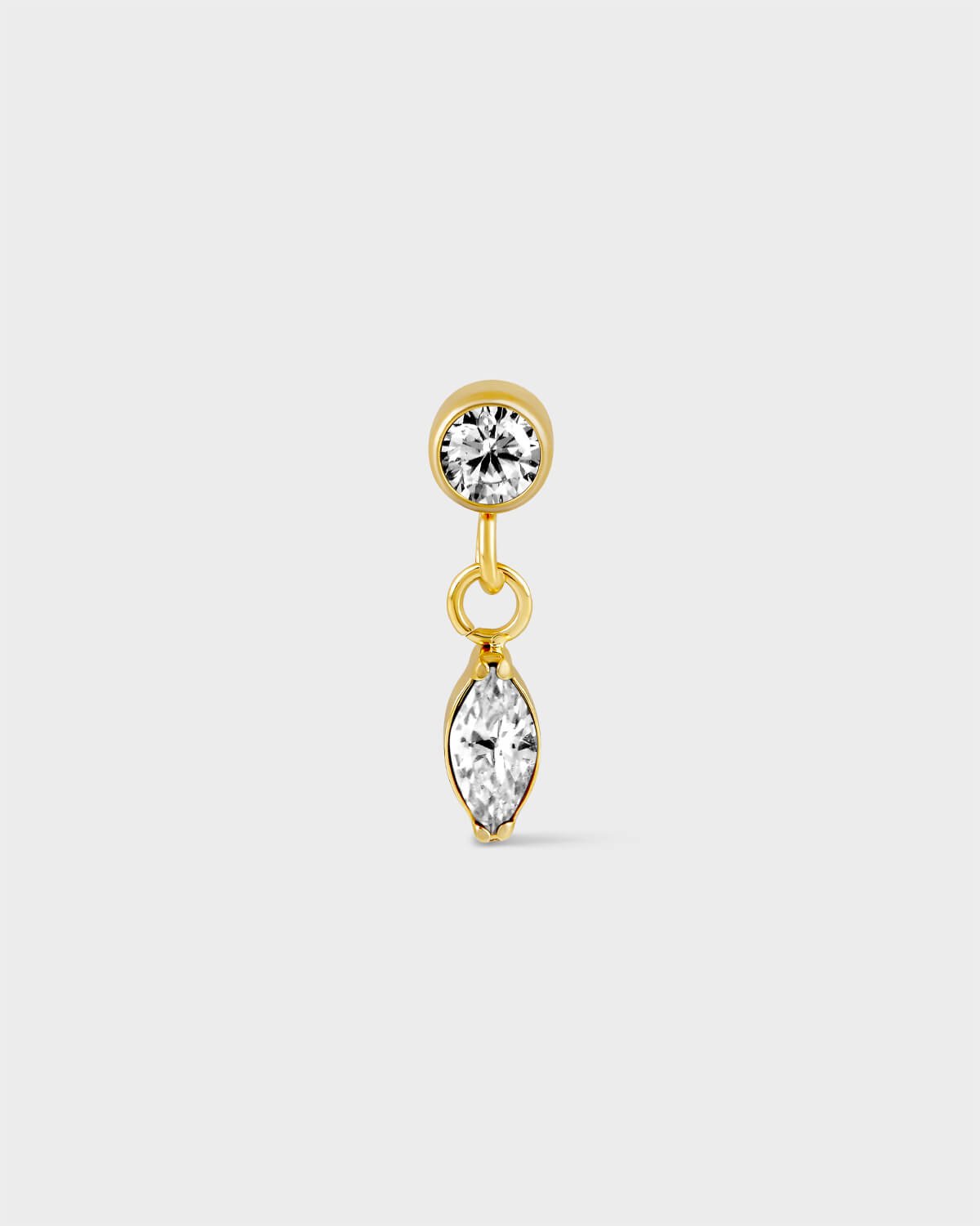 Gold titanium solitaire earring with marquise drop on a light grey background.