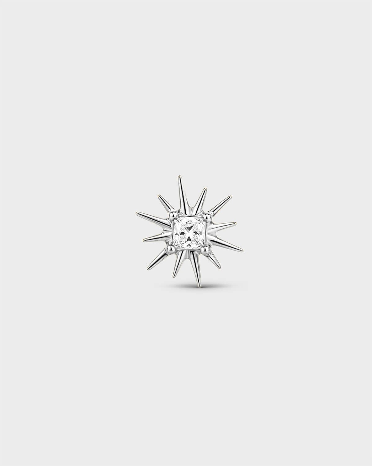 Polished silver titanium threadless end with a princess-cut clear stone set within a sculpted starburst design. On a light grey background.